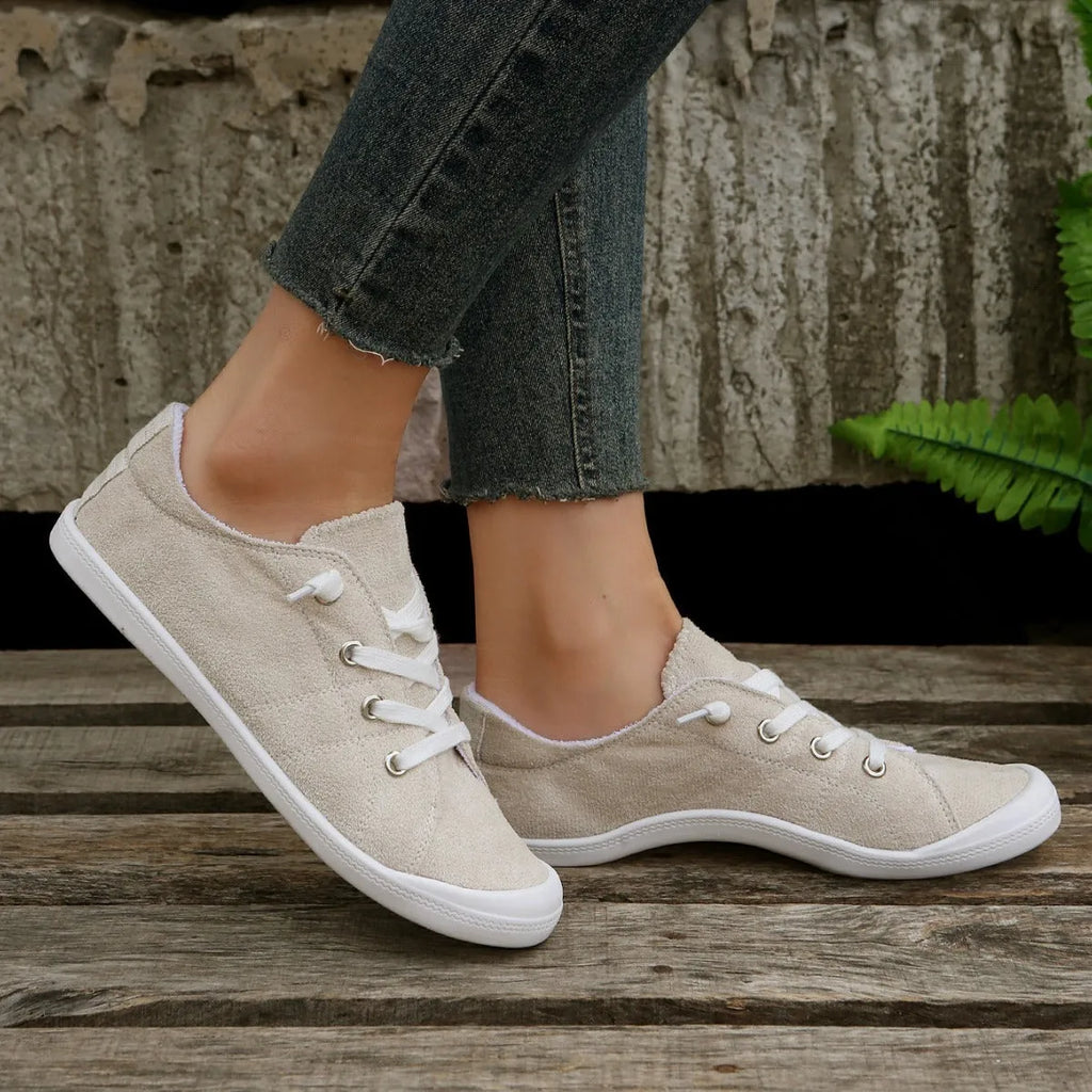Women's creamy-white casual sneakers with fabric upper and rubber sole, low-top design for versatile wear