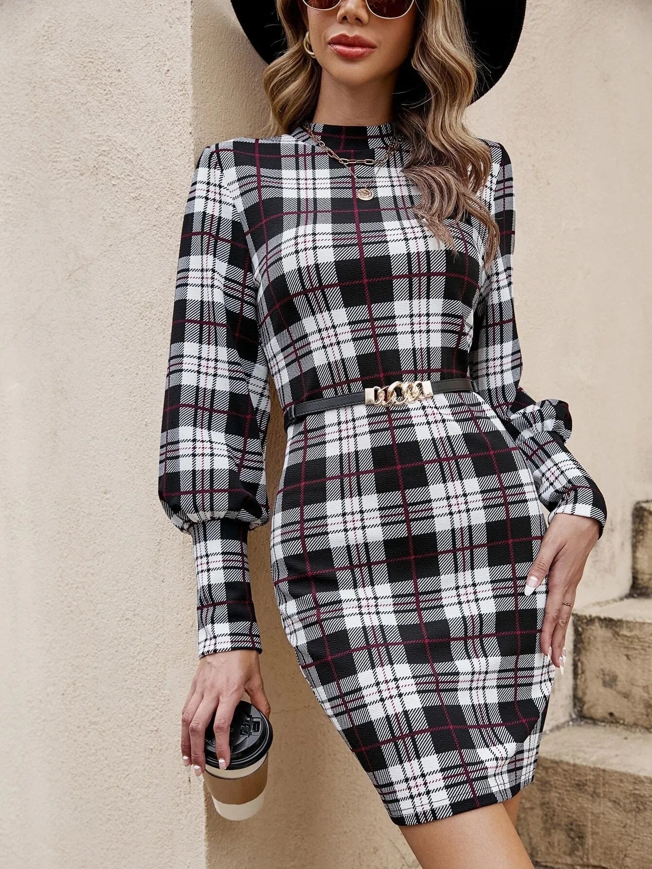 Black lantern sleeve tight dress with leather stitching details, mid-length design, shown on model