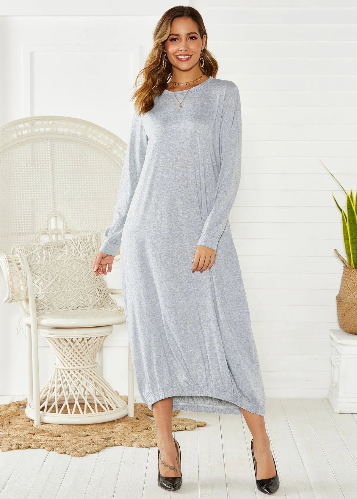 Black lace-up crew neck lantern dress with adjustable front lacing and loose fit, made from knitted polyester.