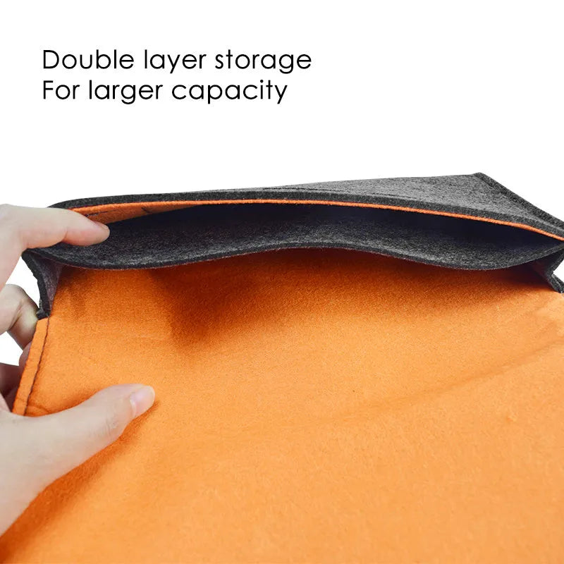 Black felt carrying pouch case for Nintendo Switch console with game card slots open.