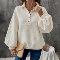 Women's solid colour polo collar sweater with long sleeves in milky white, showing thickened texture and pullover style.