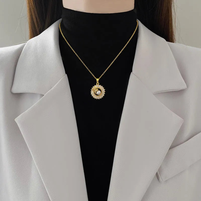 Women's geometric jewellery set with square full diamond motif, leaf design, titanium steel chain, and gold-plated copper pendant and earrings.