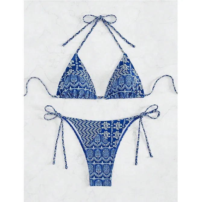 Women's green bandage-style split bikini swimsuit with stitching detail on a mannequin.