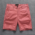 Cotton workwear shorts in camouflage pattern with mid-waist and zip fly design