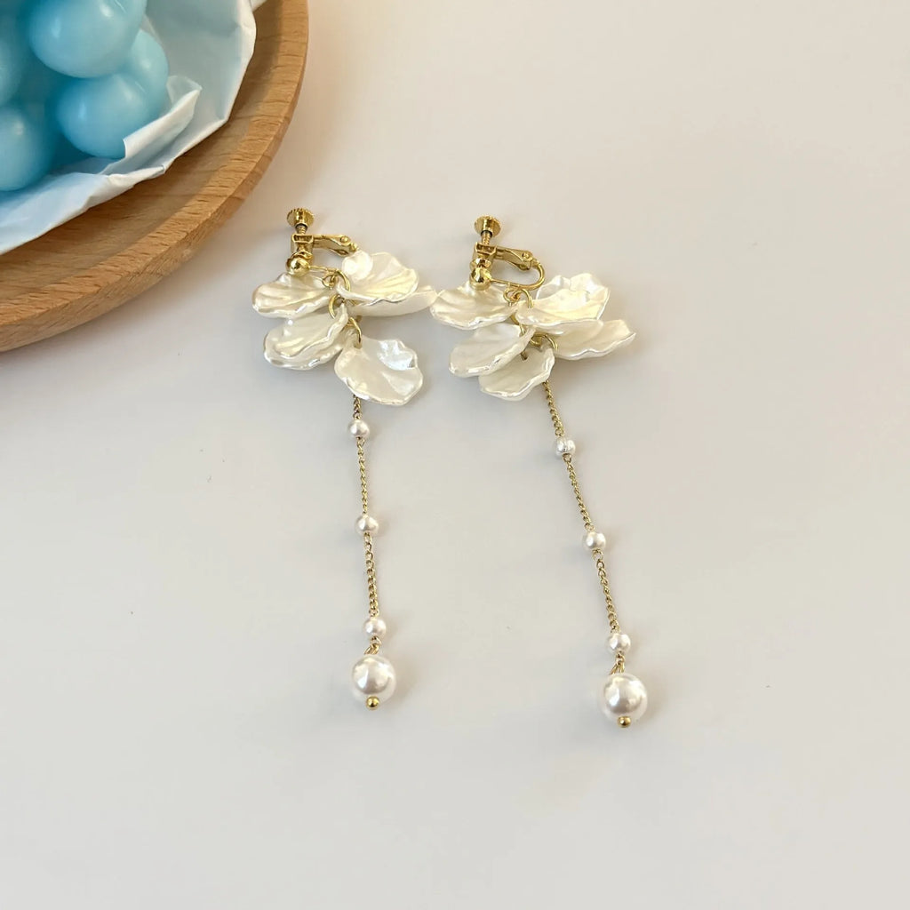 Women's fashion earrings with shell pearl tassel design measuring 8.8cm long, showing clip fastening options