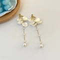 Women's fashion earrings with shell pearl tassel design measuring 8.8cm long, showing clip fastening options
