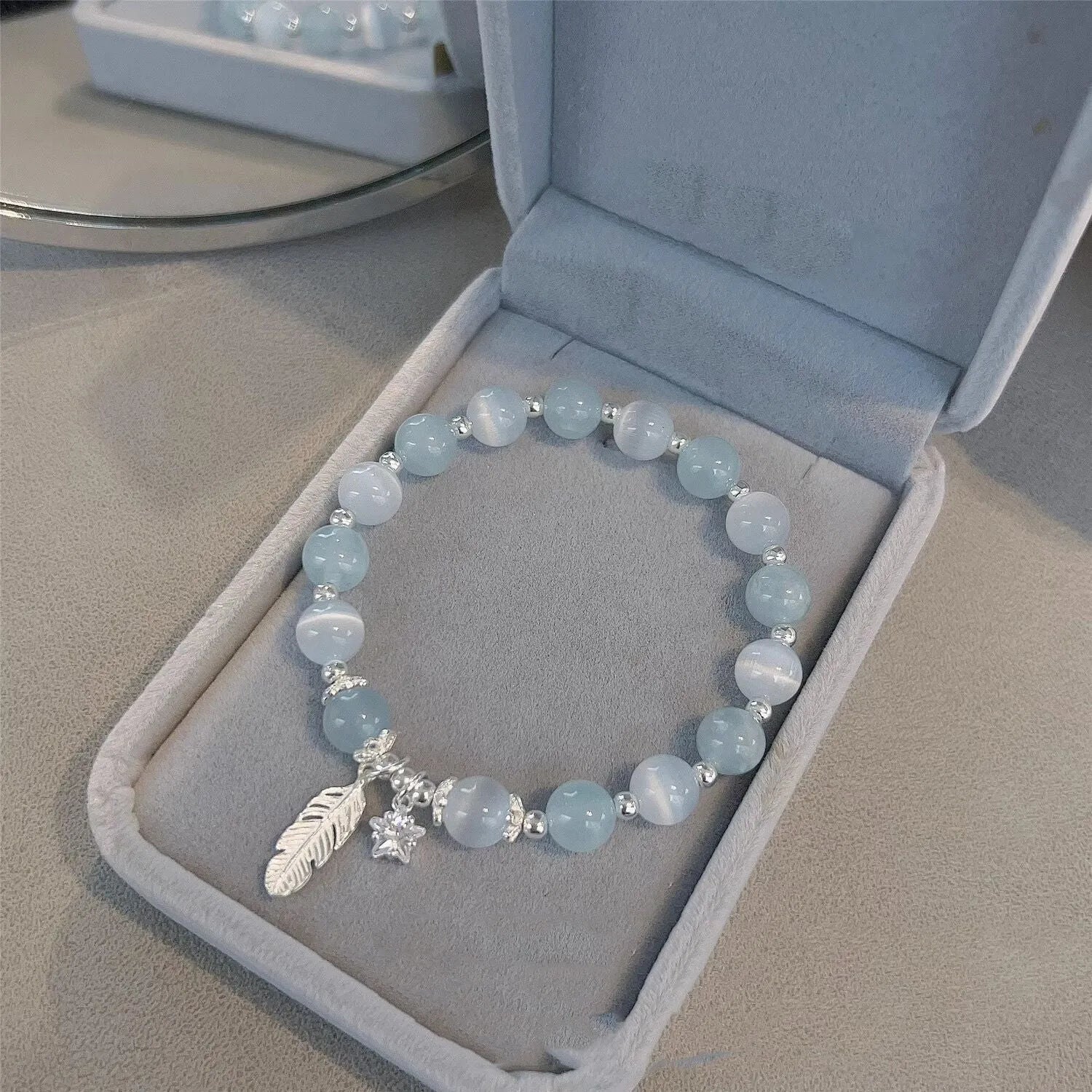 Korean style glass bracelet with feather XINGX blue moonlight colour and eight Awn star decorative elements