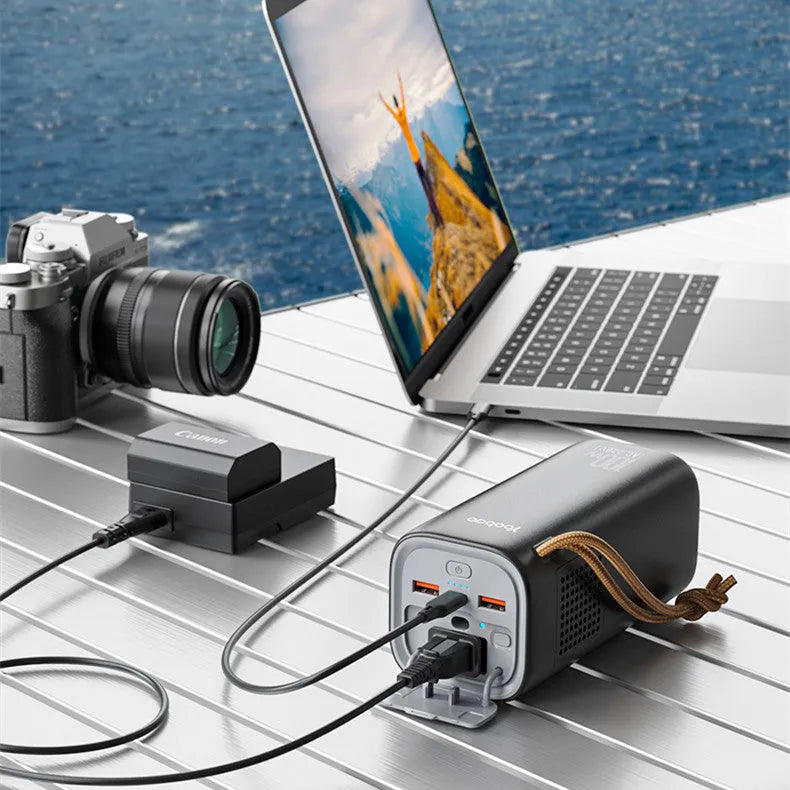 Black portable power bank with solar panel, 70mm width, showing USB ports and power indicator lights