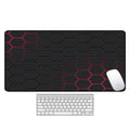 Large rectangular mouse pad with printed pattern lying flat on a wooden desk.