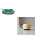 White USB cup warmer pad on desk with LED display showing temperature setting and mug on top