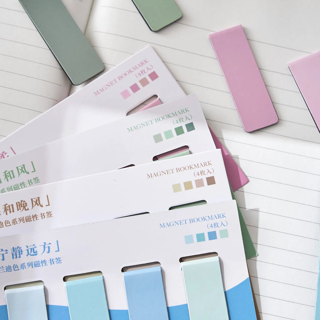 Set of four miniature magnetic bookmarks in soft pastel colours with rectangular design and embedded magnets