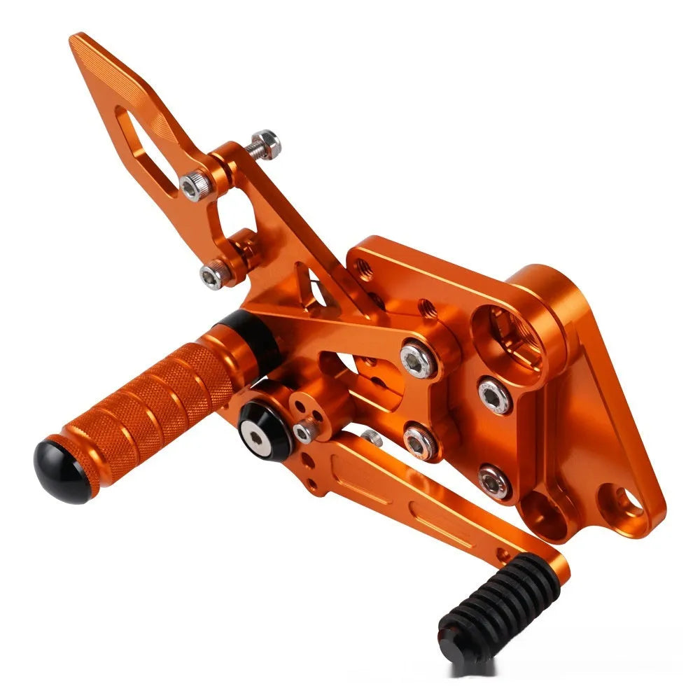 KTM Duke motorcycle rear shift pedal support assembly kit in black and orange.