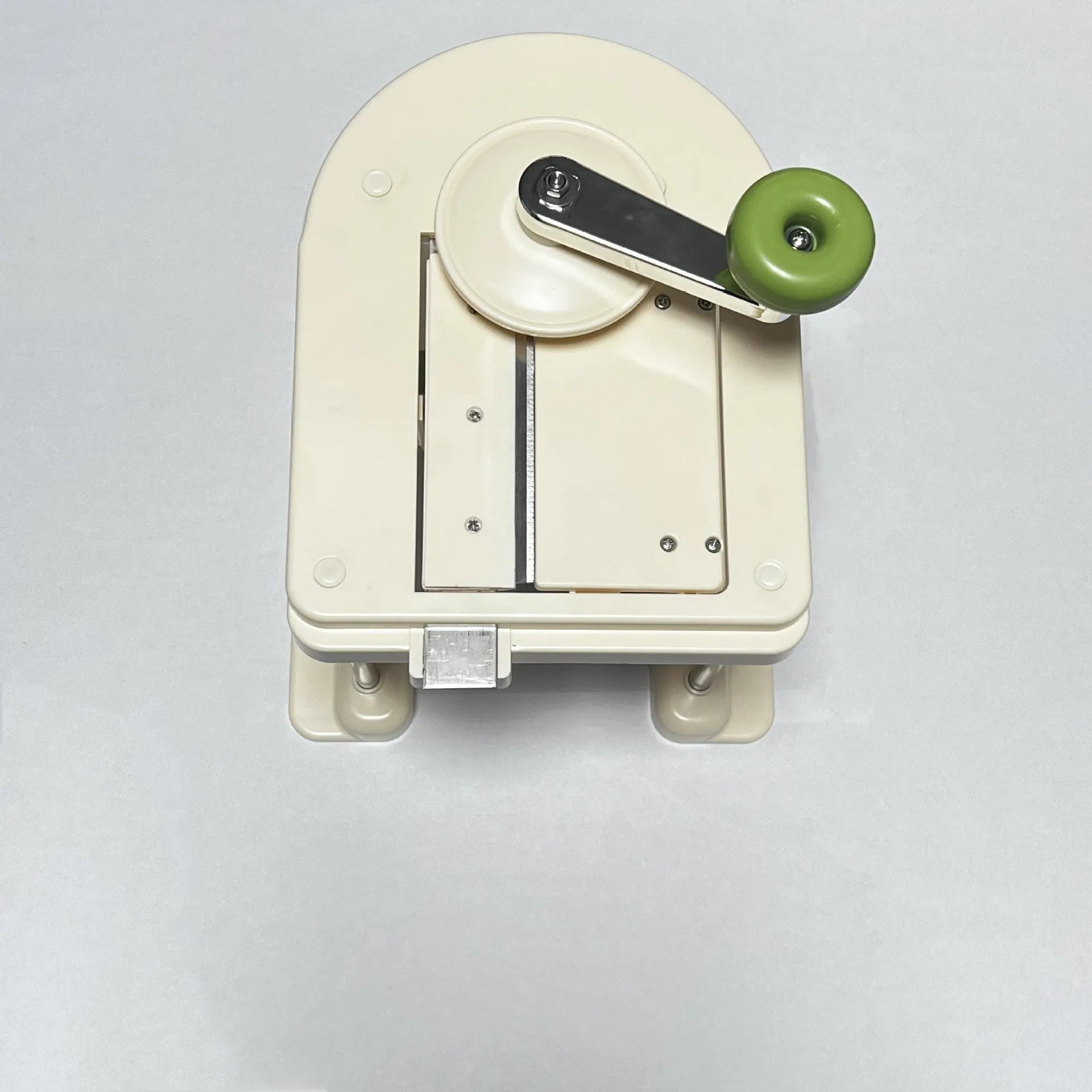 Beige multifunctional slicer chopper with stainless steel blades for shredding potatoes and vegetables.