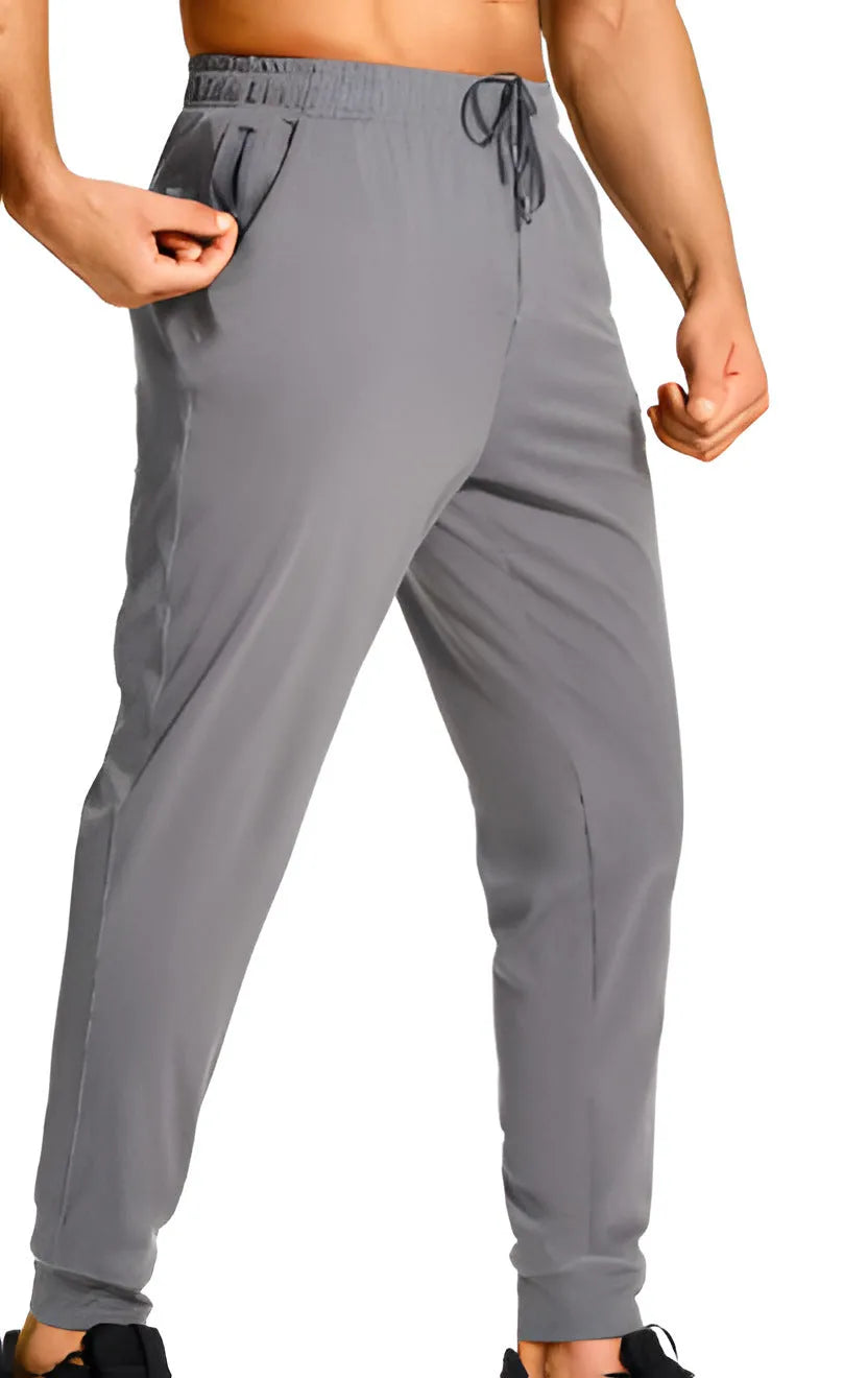 Men's loose casual trousers in solid colour, made from 100% polyester fabric, available in multiple sizes and shades for leisure wear