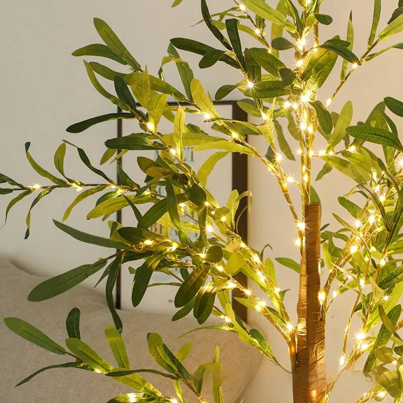 1.8m tall artificial olive tree lamp with warm white LED lights illuminating olive leaf foliage