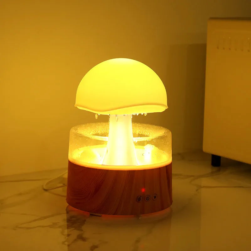 White rain cloud shaped humidifier with rainfall simulation and colour changing night light functions
