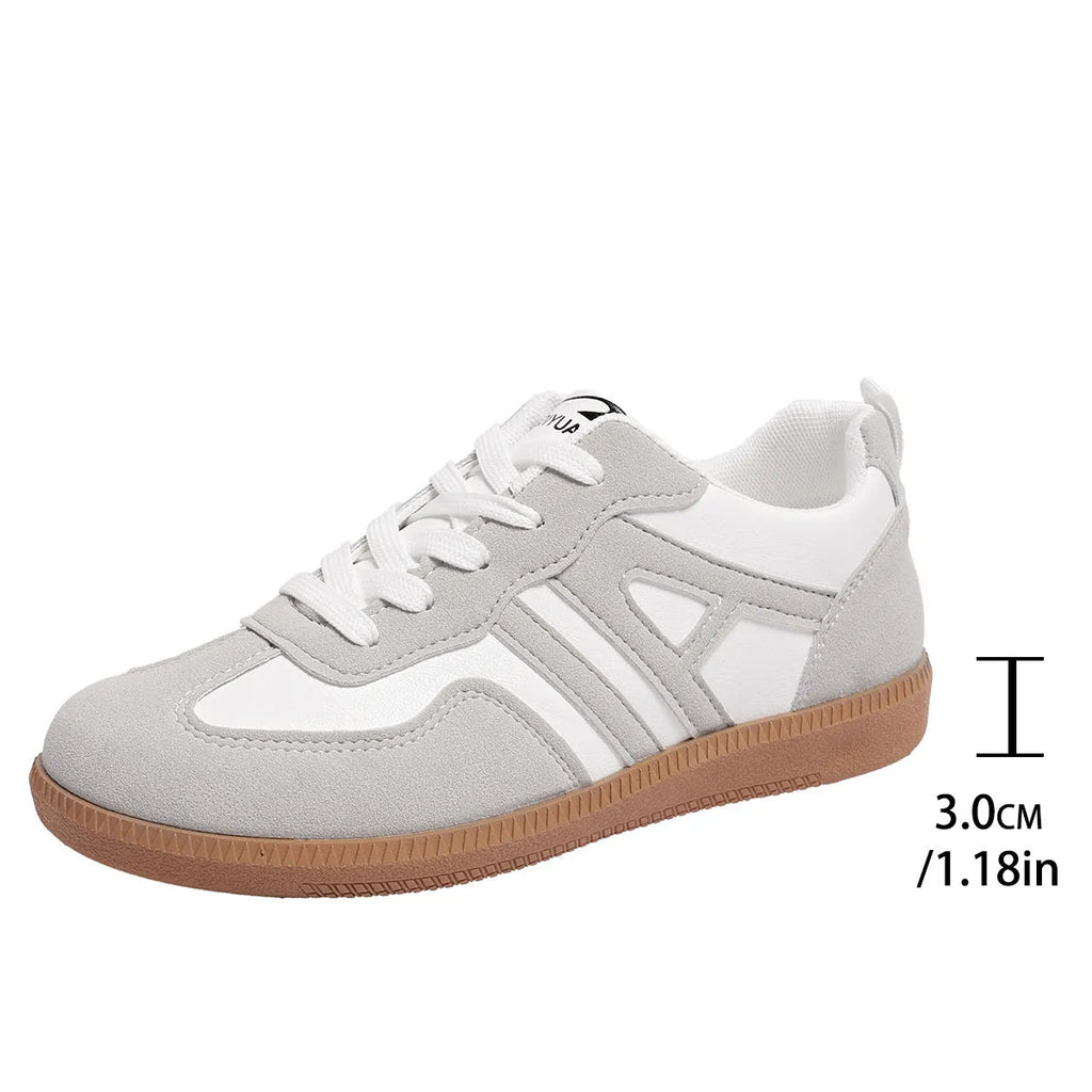 Women's retro colour matching lace-up casual trainers with a low platform heel in black, grey, or khaki.