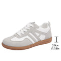 Women's retro colour matching lace-up casual trainers with a low platform heel in black, grey, or khaki.