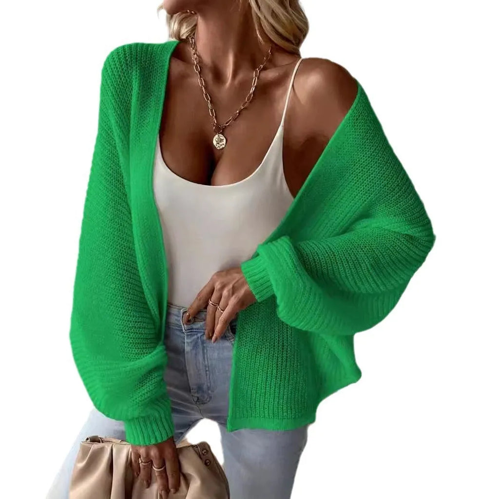 Women's loose fit batwing sleeve cardigan in solid colour, shown on a hanger.