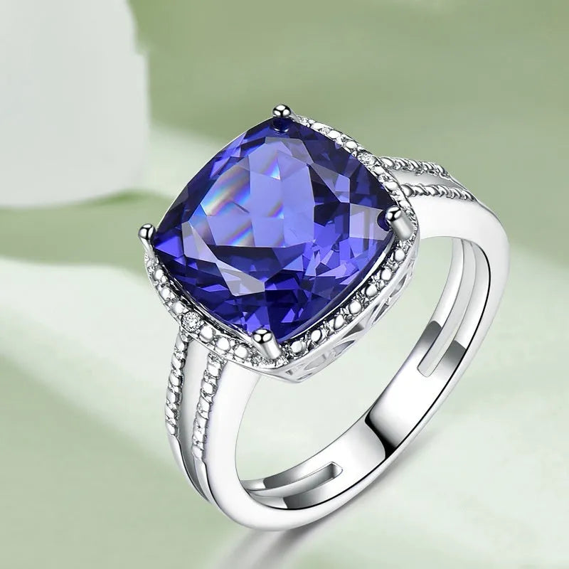 Women's 925 sterling silver ring with blue tanzanite gemstone, shown in UK sizes 6-10 for precise fit