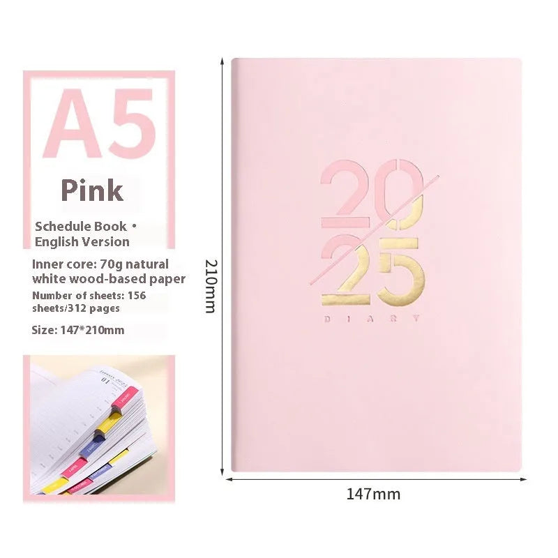 2025 A5 schedule book with faux leather cover in blue, showing open pages on a desk