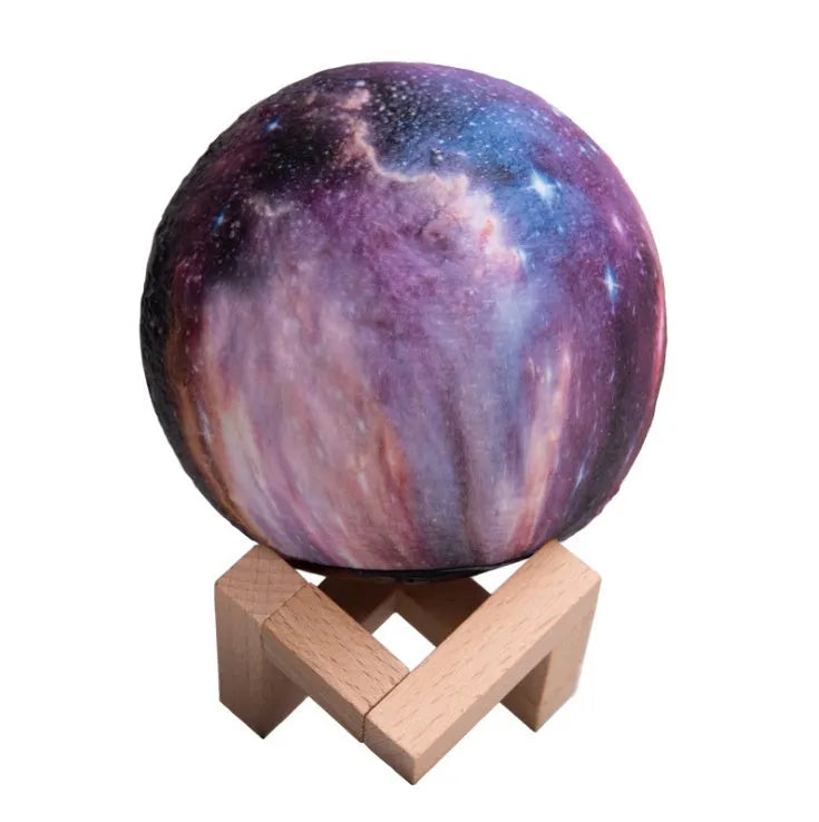 3D-printed lunar night light with LED colours, remote control, and touch sensor on wooden table