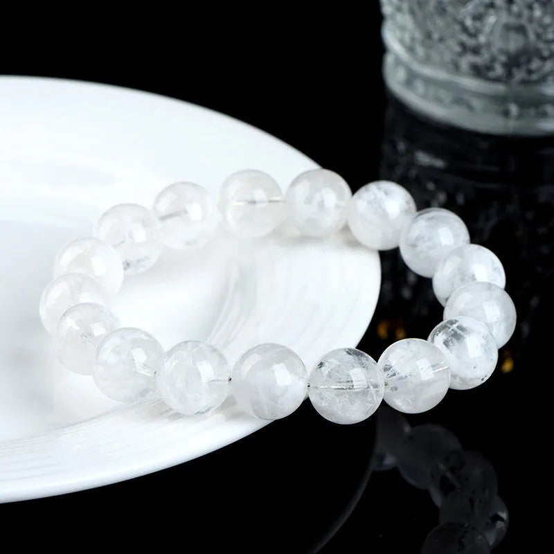 Natural blizzard crystal women's bracelet with round beads showing grinding treatment and geometric design