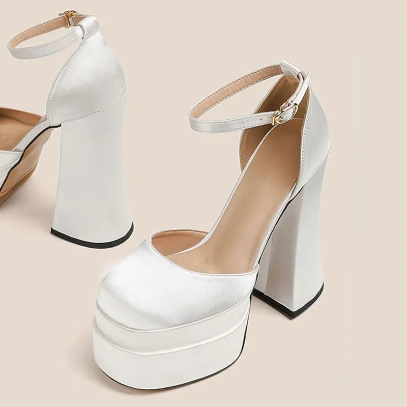 Women's white waterproof platform pumps with a chunky heel and round toe