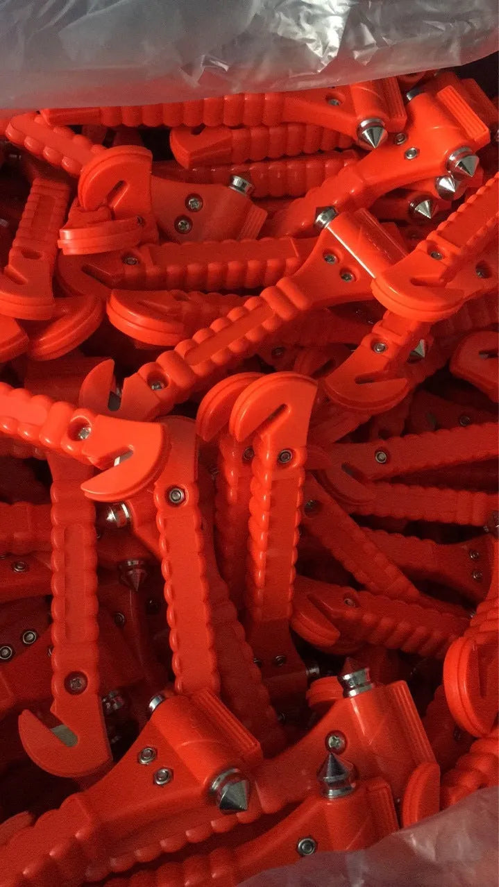 Red car emergency escape hammer with seatbelt cutter, made from ABS and carbon steel.