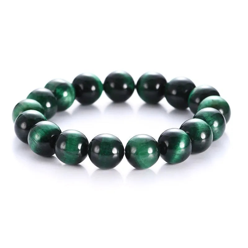 Green tiger eye stone bracelet with geometric beads in hand-polished finish showing natural colour banding