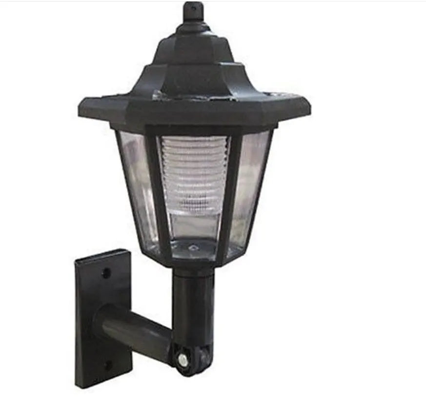Black hexagonal solar-powered LED wall light for outdoor garden use.