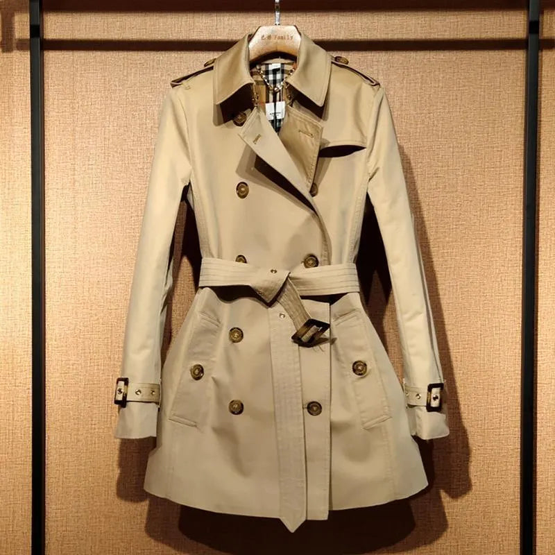 Khaki women's trench coat with double-breasted button front and distinctive flight sleeves