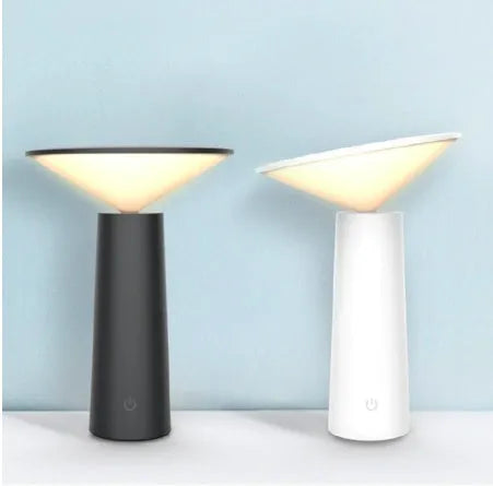 Black USB desk lamp with touch sensor and adjustable head on a wooden table
