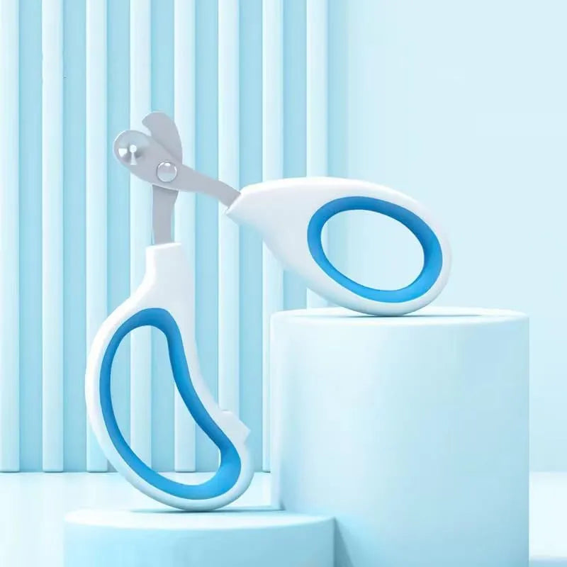 Blue cat nail clippers with circular hole and cushioned handles for trimming pet nails