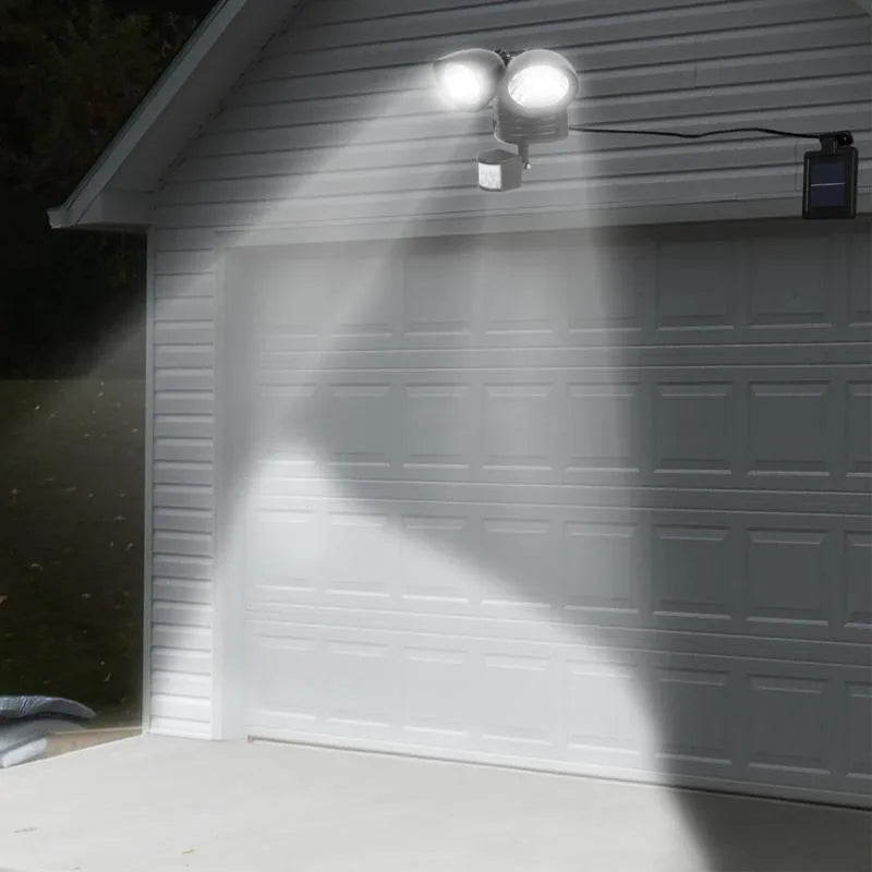 Black and white dual head solar motion sensor spotlight for outdoor security lighting