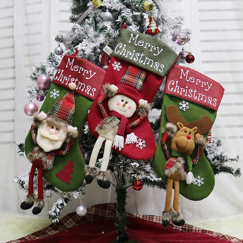 Three large Christmas stockings with Santa, Snowman, and Reindeer 3D applique designs in non-woven fabric