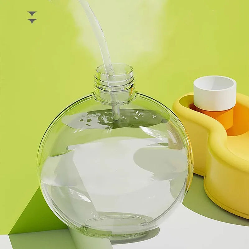 Green pet travel cup with integrated bowl for dog hydration during outdoor activities like hiking.