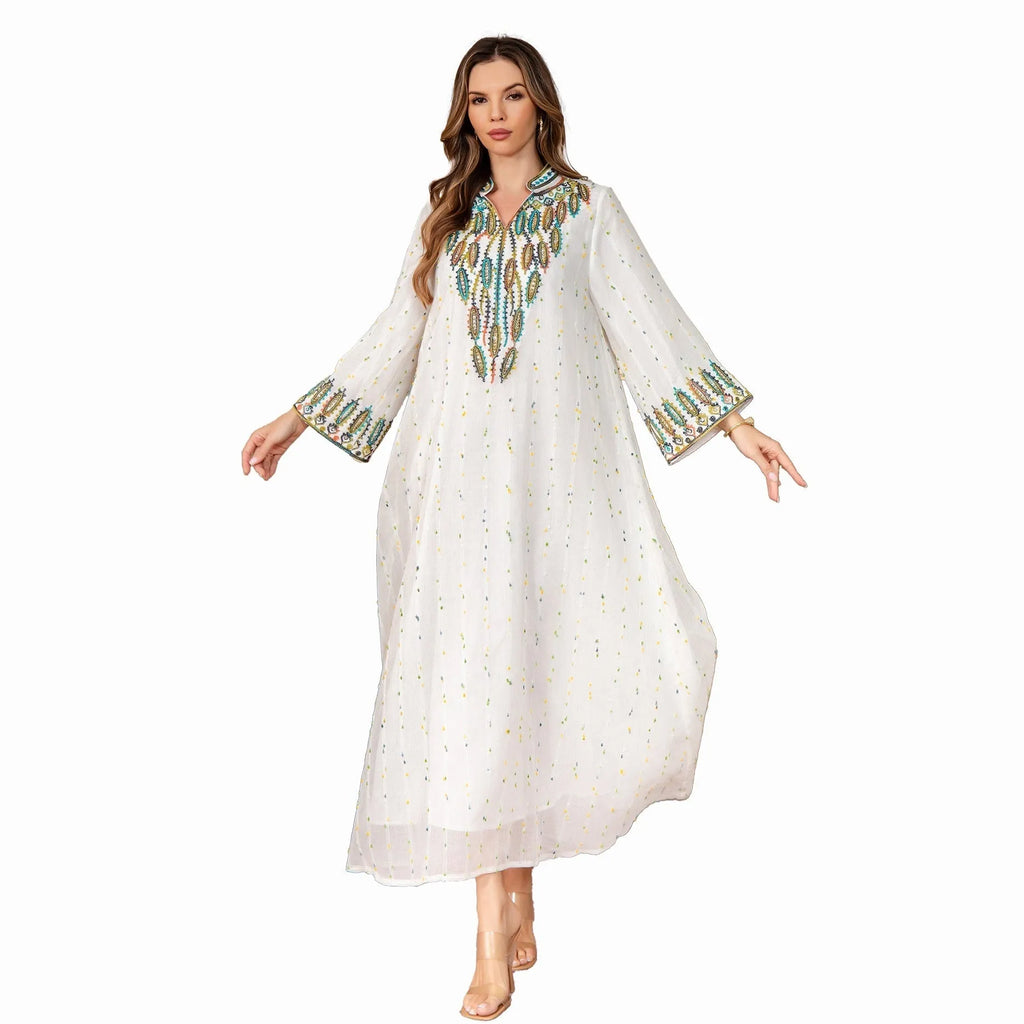 White long sleeve Arabic robe abaya with long skirt on a hanger