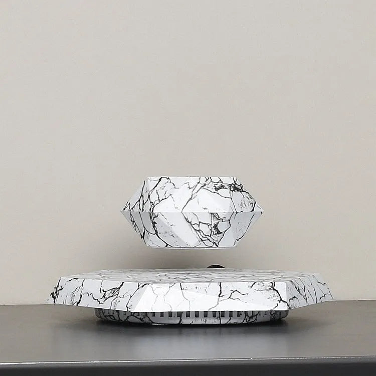 Marble-coloured levitating plant pot floating and rotating with magnetic technology for bonsai or small plants