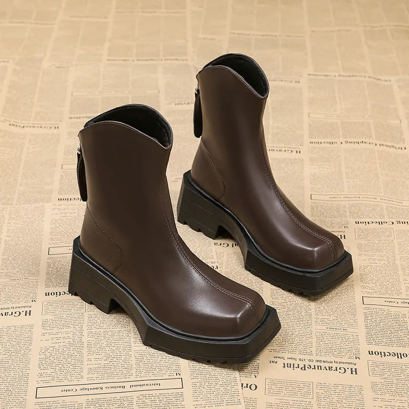 Black platform Martin boots for women with square toe, 6-8cm heel, and back zipper on a mid-calf shaft.