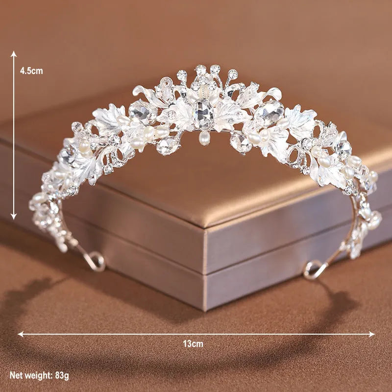 Gold and silver alloy pearl crown headdress hair accessory for women on a white background.