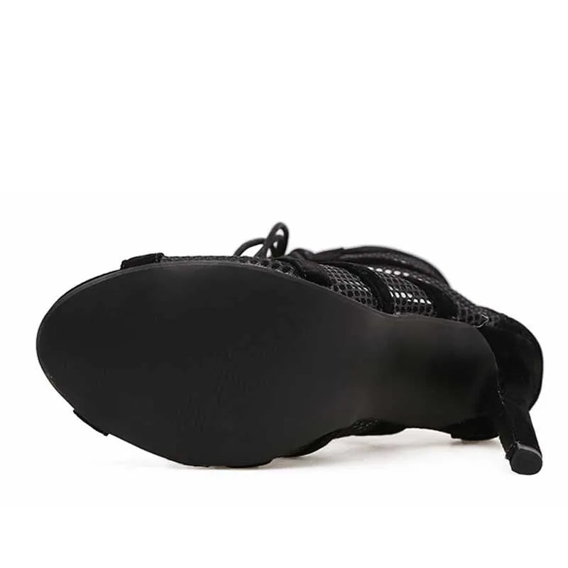 Black suede lace-up high heel women's shoes with 11.5cm heel and 1cm platform, showing adjustable laces and textured surface