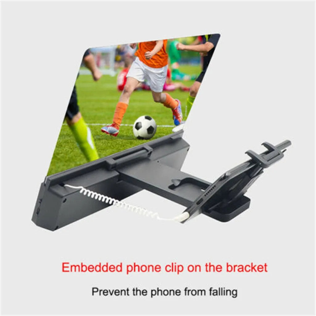 Mobile phone screen amplifier with 12-inch lens and gooseneck stand on a table, showing 3.5mm audio cable connection