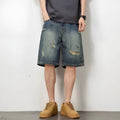 Blue retro-style men's denim shorts with a straight leg and slight distressing details on a neutral background.