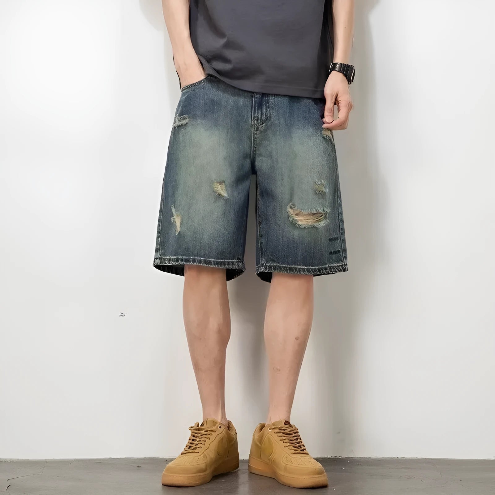 Blue retro-style men's denim shorts with a straight leg and slight distressing details on a neutral background.