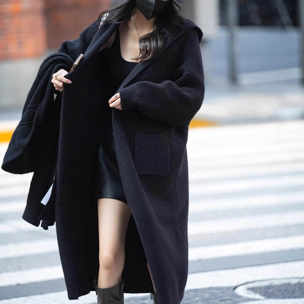 Long grey knitted cardigan with hooded trench coat design showing 80cm length and wool blend fabric texture