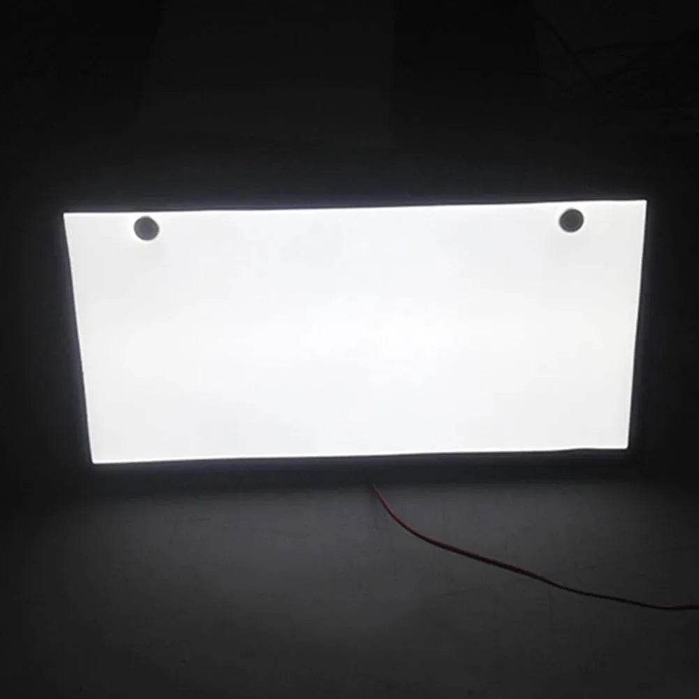 A pair of black plastic LED licence plate light bars for trucks on a white background.