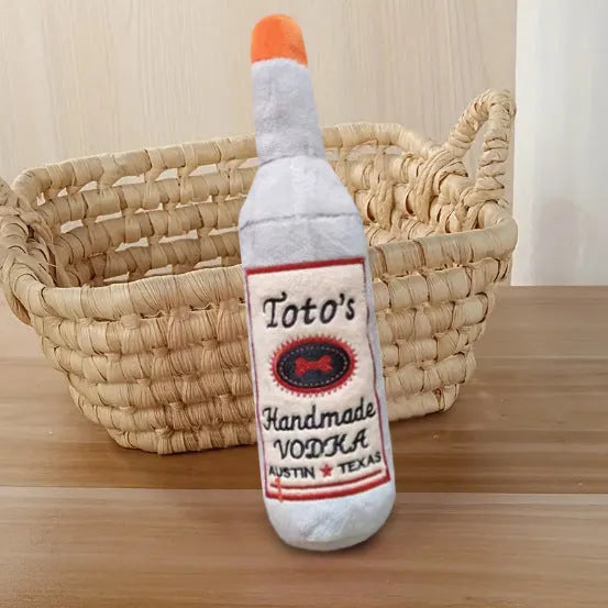 Brown wine bottle shaped plush dog toy with textured molar-like chewing surface
