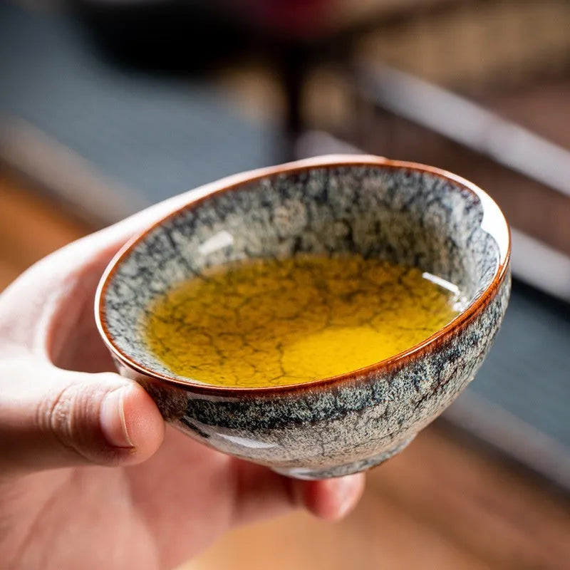 Four ceramic Gongfu tea cups in a light-coloured gift box, new Chinese style.