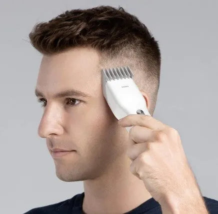 Black and white cordless hair clippers with adjustable comb, nano-ceramic cutter head, and two-speed control for precise haircuts